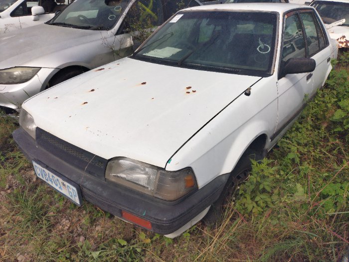 MAZDA 323 SEDAN (WHITE)
